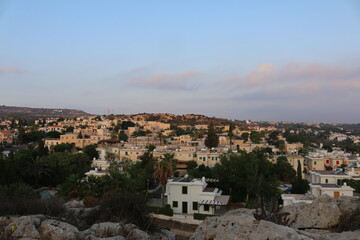 Fototapeta premium view of the city at sunset from the top of the Church of St. Elias Cyprus Protaras