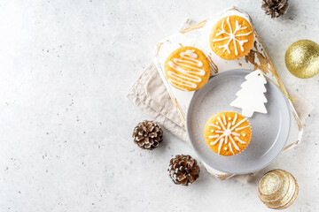 Christmas or New Year homemade mini cake with icing sugar. Festive decoration. Flat lay, top view.