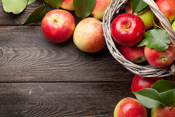 Ripe garden apple fruits on wooden table