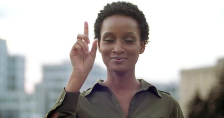 Portrait young African American woman looks at camera friendly, shows three two one on her hand, counts back sign, counts third second first on her arm, curls fingers in turn, body language, close up - Powered by Adobe