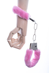 Handcuffs with fur on the hand of a puppet. Sex bondage, bdsm, role play