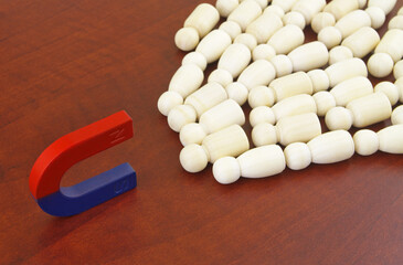 Magnet attracting many people. Control people and increase traffic concept.