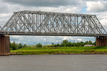 Fototapeta premium Nikolaevsky (Romanovsky) railway bridge across the Volga river in the city of Yaroslavl