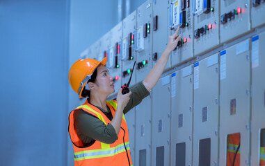 Portrait work checking and inspecting at MDB panel . she working with electric switchboard to check...