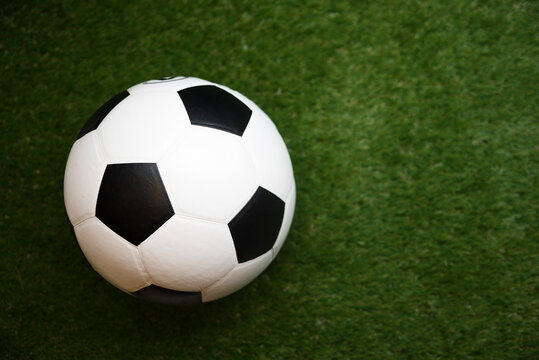 High Angle View Of Soccer Ball On Grassy Field
