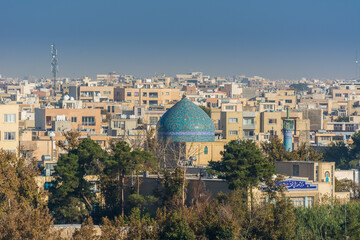 Aerial view of residential building skyline with blue tome of Lonban Mosque of Isfahan of Iran, one of the most famous historic city in the middle east.