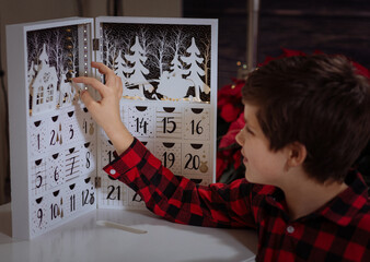 Boy counting days till Christmas