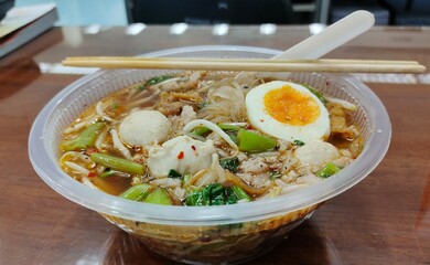 thai noodle spicy soup, with pork and egg