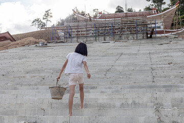 Children working at construction site for world day against child labor concept: