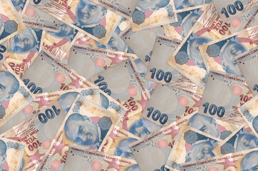 100 Turkish liras bills lies in big pile. Rich life conceptual background