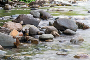 Fototapeta na wymiar Rocky stream running water of mountain river