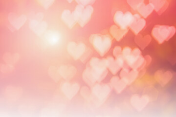 Valentines day background banner - Abstract light red, pink, orange bokeh pattern in heart shape holiday background.