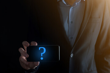 Businessman man hand hold interface question marks sign web. Ask quiestion online, FAQ concept, what where when how and why, search information on internet