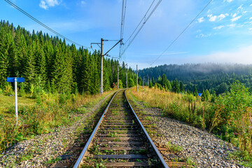 Fototapeta premium Railway track in the forest in a mountainous area