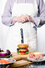 Obraz na płótnie Canvas burger cheeseburger hamburger big chif cook cooking white background home