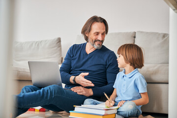 Enthusiastic parent ready to help his child with homework