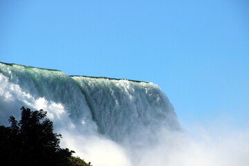 Niagara Falls from the American part, a huge stream of clear water, the power of nature in its incarnation.