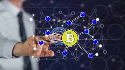 Man touching a bitcoin concept