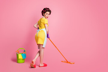 Full length back rear spine view photo cute girl wash floor mop wear dotted dress gloves isolated pastel color background