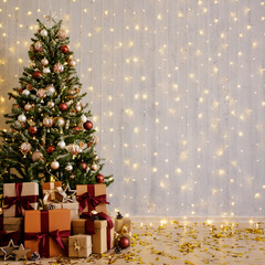 Christmas tree with gifts over wall with lights
