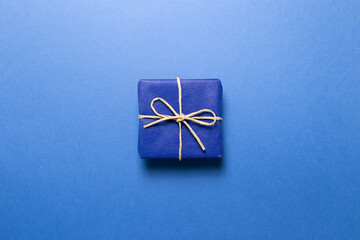 Blue gift box on blue background. top view