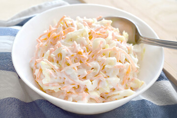 Coleslaw salad with carrot and cabbage.