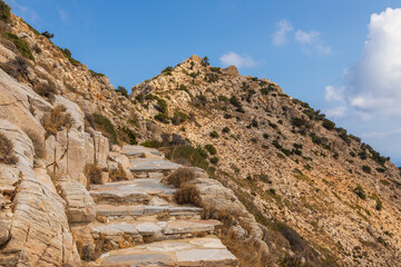 Stone mountain path to Palaiokastro, Ios Island, Greece.