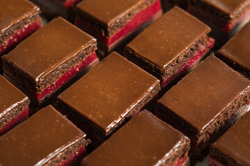 The closeup of pieces of cakes with chocolate
