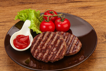 Grilled burger cutlet with sauce
