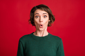 Photo of shocked person cant believe look camera wear dark green sweater isolated on red color background