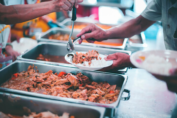Beggar begs food from donors: The Concept of Hunger Hunger: : The concept of feeding