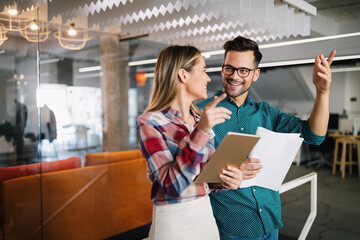 Business people having fun and chatting at workplace office