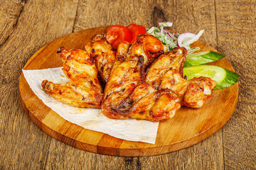 Chicken wings barbeque vith vegetables