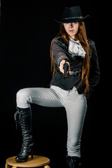 Steampunk. The character is a girl in a hat. Young woman. Studio photography. Portrait.