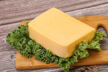 Tasty yelloow Tilsiter cheese brick