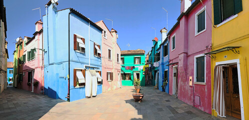 Fototapeta na wymiar Brightly coloured houses at Burano, island in the Venetian Lagoon, Venice, Italy