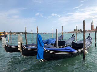 Fototapeta na wymiar Gondolas along the canal in Venice, Italy