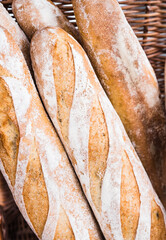 A basket of 'French sticks' aka baguette bread on sale at an artisan market