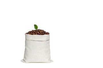 Coffee beans with a green leaf in a bag made of light linen fabric isolated on a white background