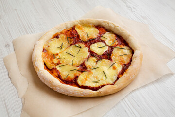 Homemade Margherita Pizza with Mozzarella and Rosemary, side view.