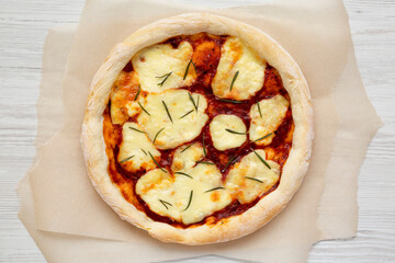 Homemade Margherita Pizza with Mozzarella and Rosemary, top view. Flat lay, overhead, from above.
