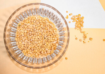 Dry yellow peas poured into a transparent Cup.