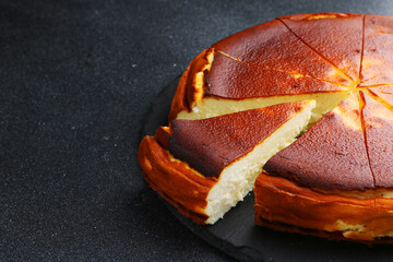cheesecake san sebastian close up on dark table