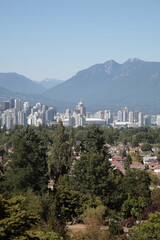 View of Vancouver downtown skyline with mountains and ocean during summer seen from Queen Elizabeth...