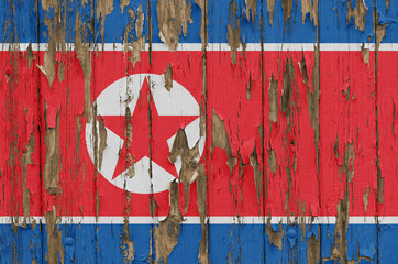 Flag of North Korea on a weathered wooden wall