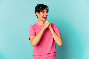 Young caucasian skinny man expressing emotions isolated on blue background