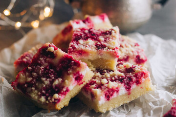 Delicious pie with raspberries and curd cheese. Pieces of pie on the table