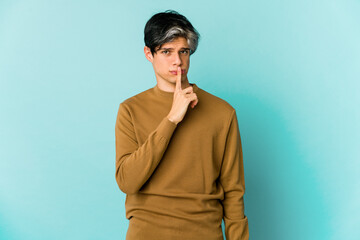 Young caucasian skinny man expressing emotions isolated on blue background