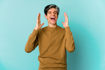 Young caucasian skinny man expressing emotions isolated on blue background