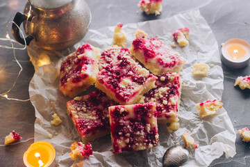 Delicious pie with raspberries and curd cheese. Pieces of pie on the table